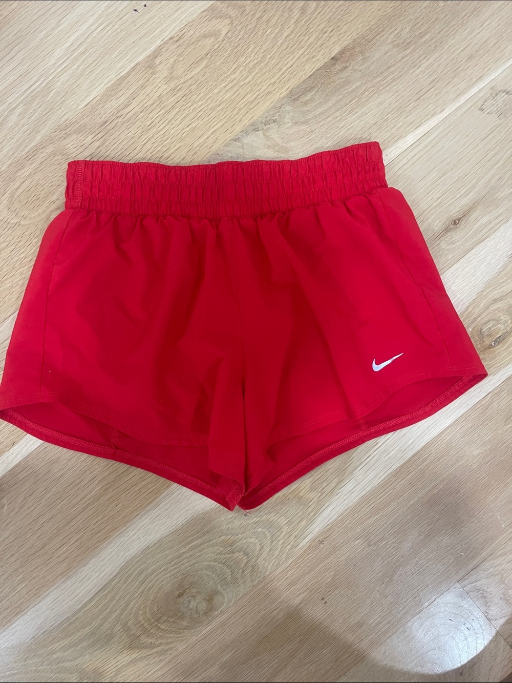 Nike Women's Red Athletic Workout Shorts with White Swoosh